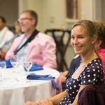 Audience members enjoying the presentation